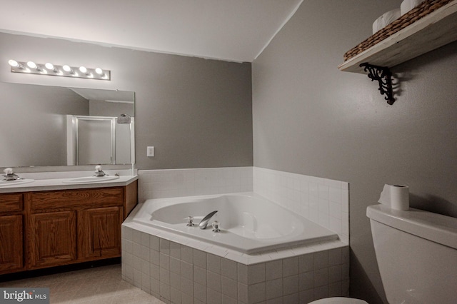 bathroom with a sink, tile patterned flooring, a shower stall, double vanity, and a bath