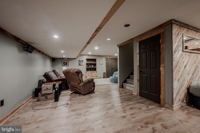 interior space with stairs, wood finished floors, baseboards, and recessed lighting
