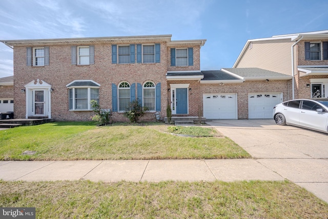 colonial-style house with a garage, a front lawn, brick siding, and driveway
