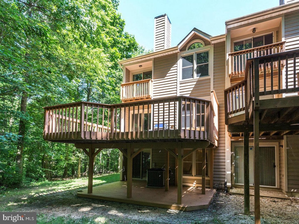 5957 Cedar Fern Ct, Columbia, MD 21044 - rear view of property featuring a balcony, a deck, a chimney, and central AC unit