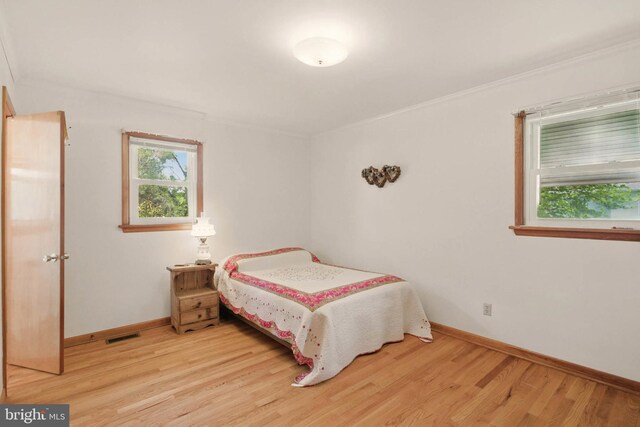 111 Trevanion Rd, Taneytown, MD 21787 - bedroom with wood finished floors, baseboards, and crown molding