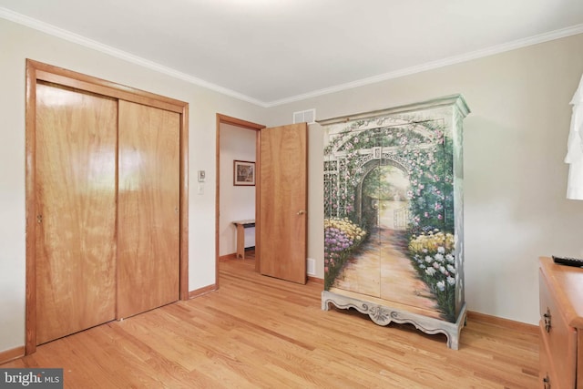111 Trevanion Rd, Taneytown, MD 21787 - bedroom with light wood finished floors, crown molding, baseboards, and a closet