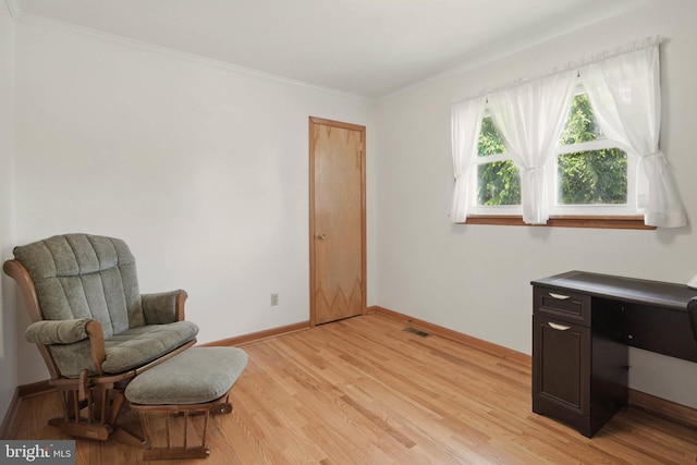 111 Trevanion Rd, Taneytown, MD 21787 - living area with light wood-style flooring, baseboards, and ornamental molding