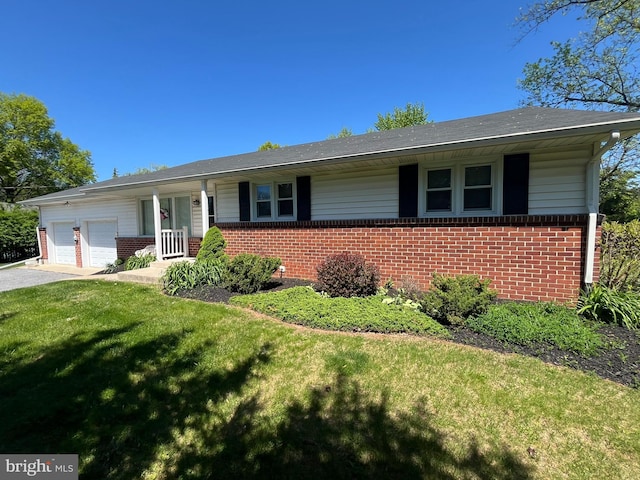 111 Trevanion Rd, Taneytown, MD 21787 - single story home with brick siding, an attached garage, and a front lawn