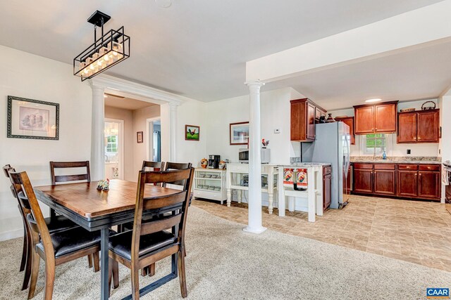 654 Bybee Rd, Louisa, VA 23093 - dining area featuring decorative columns, healthy amount of natural light, and light colored carpet