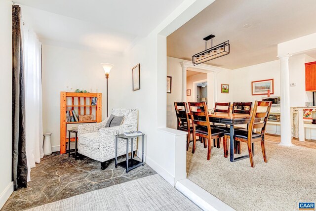 654 Bybee Rd, Louisa, VA 23093 - carpeted dining space with decorative columns and baseboards