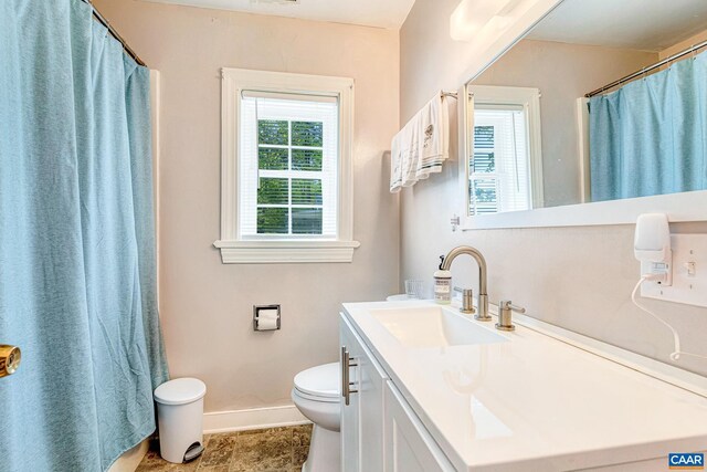 654 Bybee Rd, Louisa, VA 23093 - full bath with baseboards, toilet, vanity, and a shower with shower curtain