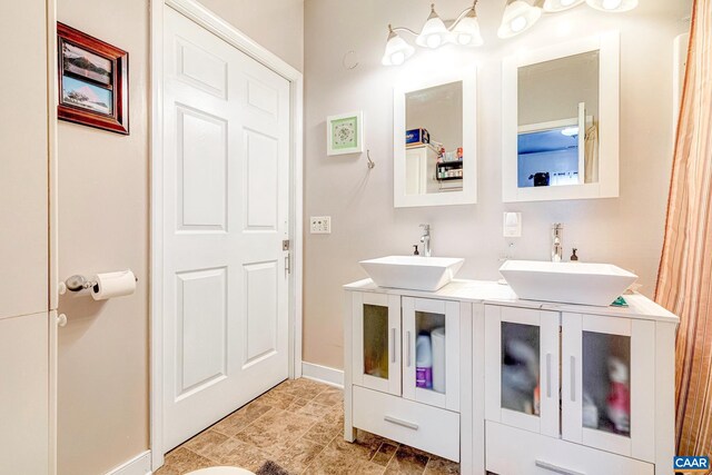 654 Bybee Rd, Louisa, VA 23093 - bathroom with double vanity and baseboards