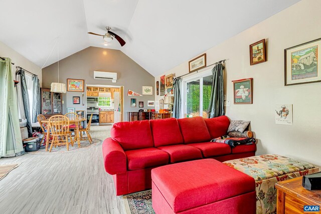 654 Bybee Rd, Louisa, VA 23093 - living room with an AC wall unit, ceiling fan, lofted ceiling, wood finished floors, and plenty of natural light