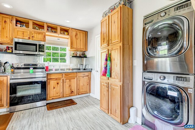 654 Bybee Rd, Louisa, VA 23093 - kitchen featuring stainless steel appliances, stacked washer / drying machine, open shelves, recessed lighting, and light wood-type flooring