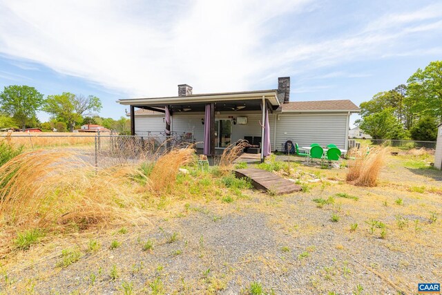 654 Bybee Rd, Louisa, VA 23093 - rear view of house featuring a chimney and fence
