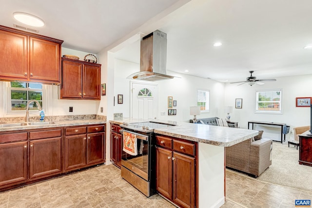 654 Bybee Rd, Louisa, VA 23093 - kitchen with island exhaust hood, stainless steel electric range oven, a sink, a peninsula, and light countertops