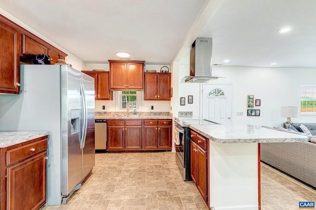 654 Bybee Rd, Louisa, VA 23093 - kitchen featuring range hood, stainless steel appliances, open floor plan, a peninsula, and light countertops