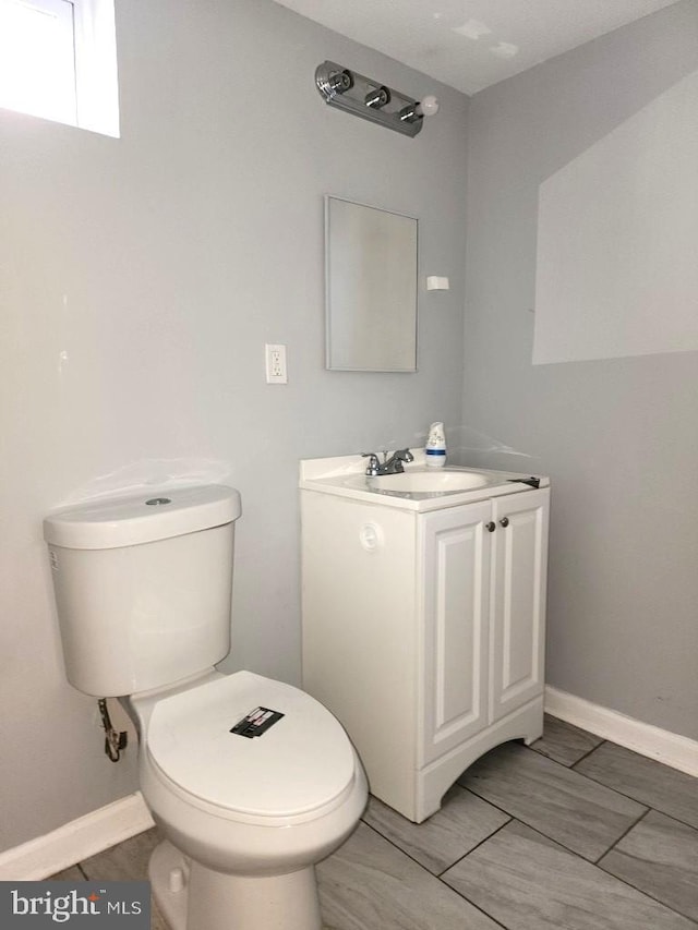 4503 Lasalle Ave, Baltimore, MD 21206 - half bathroom featuring toilet, baseboards, and vanity