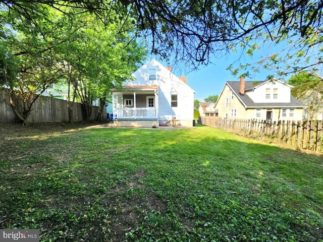 4503 Lasalle Ave, Baltimore, MD 21206 - rear view of house with a porch, a fenced backyard, and a yard