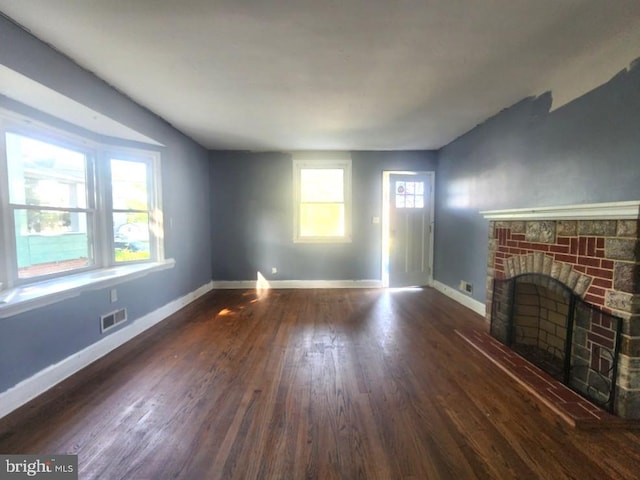 4503 Lasalle Ave, Baltimore, MD 21206 - unfurnished living room featuring wood finished floors, visible vents, a fireplace, and baseboards