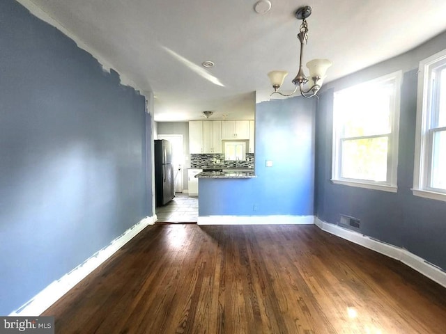 4503 Lasalle Ave, Baltimore, MD 21206 - interior space featuring baseboards, an inviting chandelier, visible vents, and wood finished floors