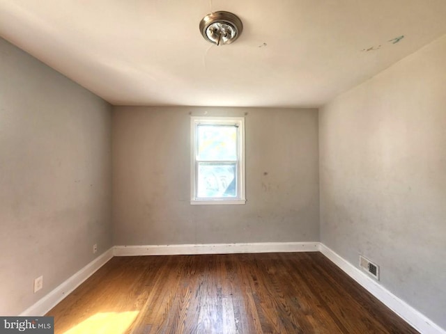 4503 Lasalle Ave, Baltimore, MD 21206 - empty room featuring baseboards, visible vents, and dark wood-type flooring