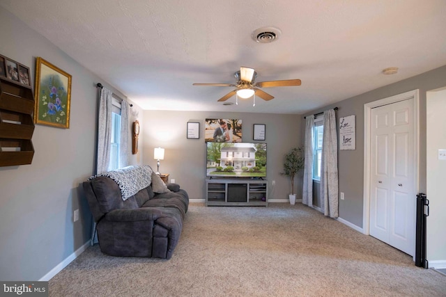 627 Ash St, Strasburg, VA 22657 - carpeted living area featuring plenty of natural light, a ceiling fan, and baseboards