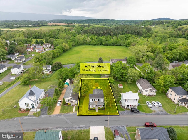 627 Ash St, Strasburg, VA 22657 - aerial view of residential area with property parcel outlined and a forest