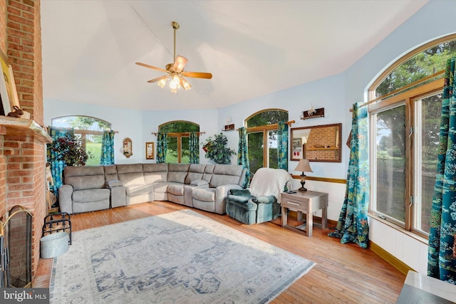 177 Pearce Creek Dr, Earleville, MD 21919 - living area with ceiling fan, hardwood / wood-style floors, vaulted ceiling, and a fireplace