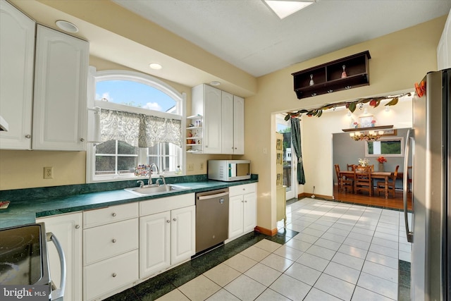 177 Pearce Creek Dr, Earleville, MD 21919 - kitchen with a sink, appliances with stainless steel finishes, dark countertops, and white cabinets