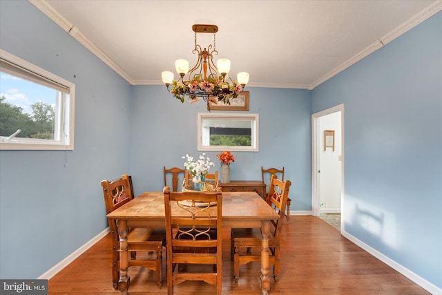 177 Pearce Creek Dr, Earleville, MD 21919 - dining space featuring a chandelier, wood finished floors, crown molding, and baseboards