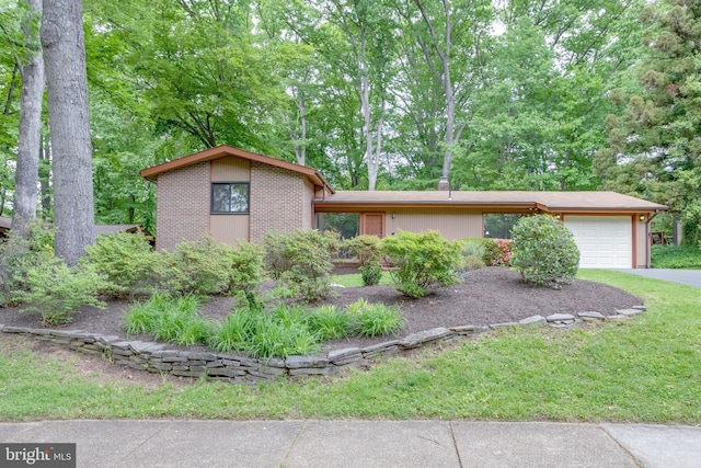mid-century inspired home featuring an attached garage, driveway, and a front lawn