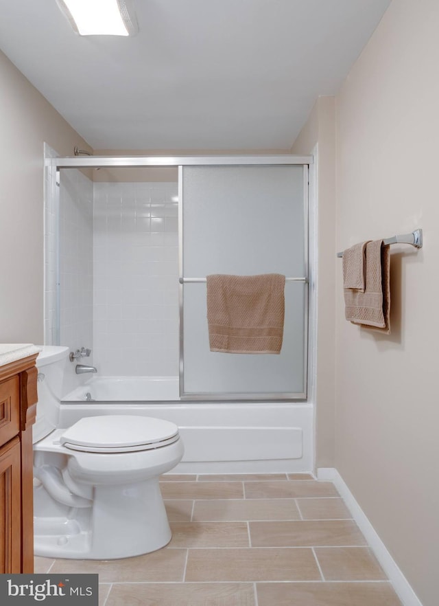 full bathroom with toilet, vanity, and combined bath / shower with glass door