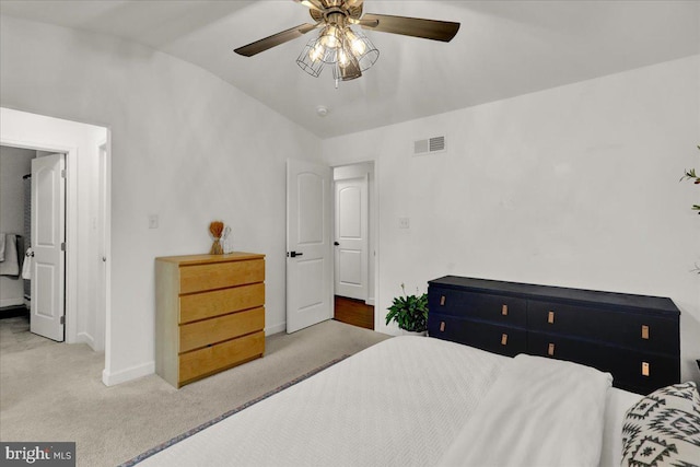 bedroom featuring lofted ceiling, carpet floors, baseboards, and ceiling fan