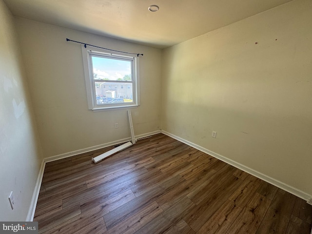 1165 S Division St, Salisbury, MD 21804 - empty room with baseboards, visible vents, and dark wood-style floors