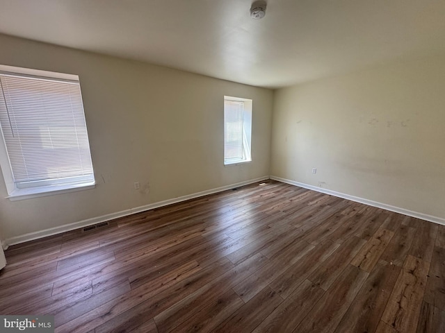 1165 S Division St, Salisbury, MD 21804 - unfurnished room featuring baseboards, visible vents, and dark wood finished floors