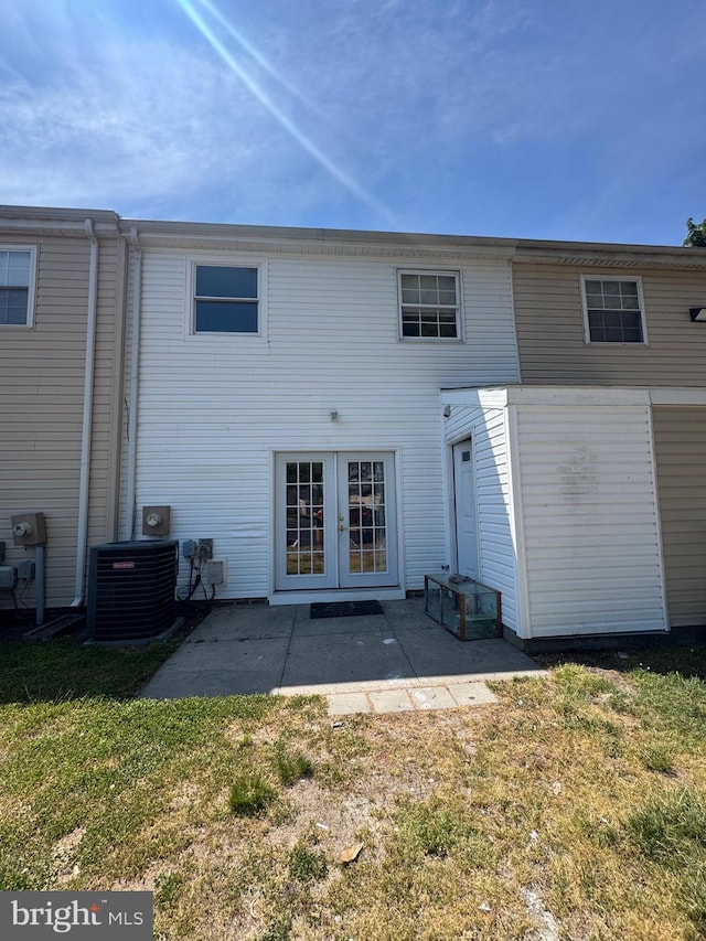1165 S Division St, Salisbury, MD 21804 - rear view of house with cooling unit, a patio area, french doors, and a lawn