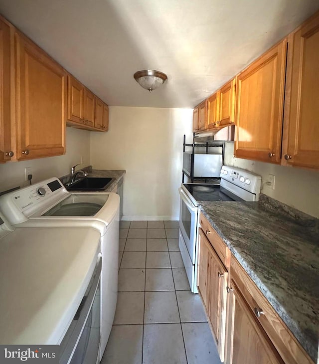 1165 S Division St, Salisbury, MD 21804 - laundry area with baseboards, light tile patterned floors, a sink, washer and clothes dryer, and laundry area