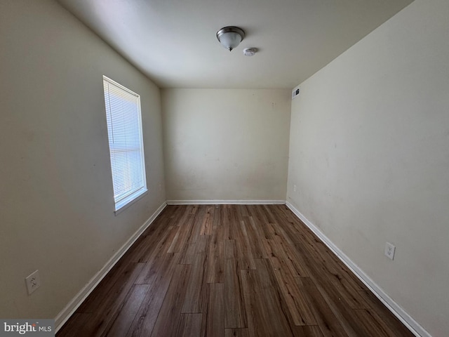 1165 S Division St, Salisbury, MD 21804 - unfurnished room with dark wood-style flooring and baseboards