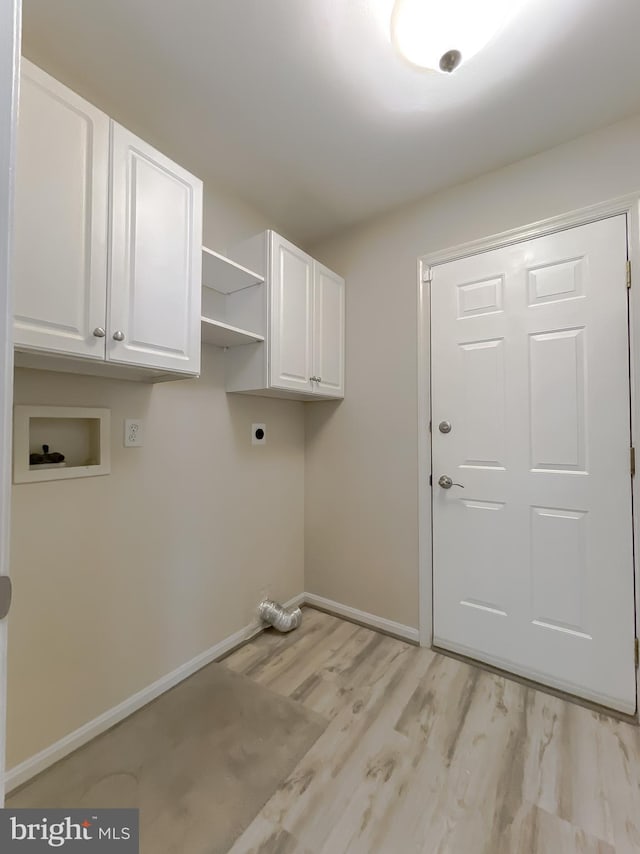 laundry area featuring baseboards, hookup for a washing machine, light wood-type flooring, cabinet space, and electric dryer hookup