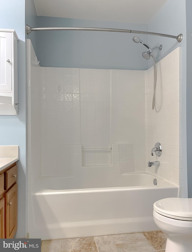 bathroom with vanity, toilet, and shower / bathtub combination