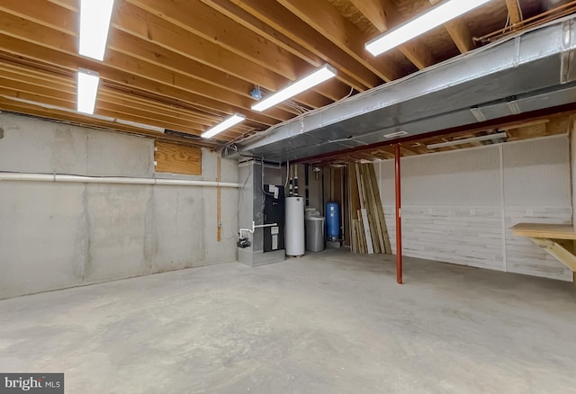 unfinished basement featuring heating unit and gas water heater
