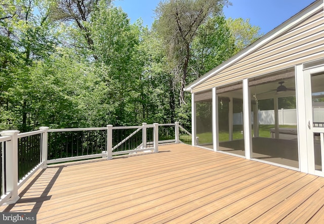 wooden deck featuring a sunroom