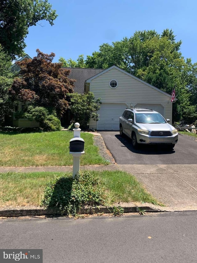 905 Pebble Ln, Southampton, PA 18966 - view of front of property with a garage, a front lawn, and driveway