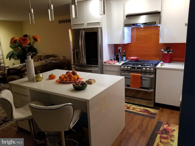 905 Pebble Ln, Southampton, PA 18966 - kitchen with ventilation hood, white cabinetry, visible vents, light wood-type flooring, and appliances with stainless steel finishes