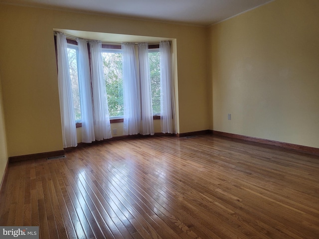 905 Pebble Ln, Southampton, PA 18966 - empty room featuring crown molding, baseboards, and wood-type flooring
