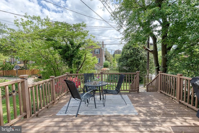deck featuring outdoor dining area