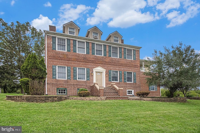 106 Shiery Ct, Gilbertsville, PA 19525 - view of front of property featuring brick siding, a front yard, and a chimney