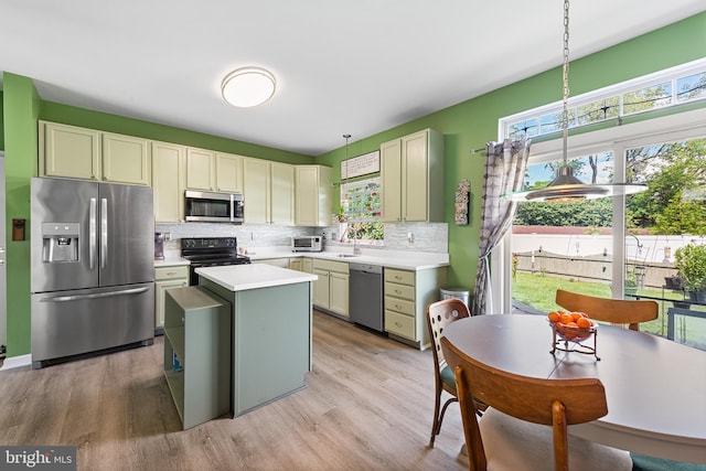 1 Deep Pond Dr, Spring City, PA 19475 - kitchen featuring appliances with stainless steel finishes, a sink, backsplash, light countertops, and light wood-type flooring