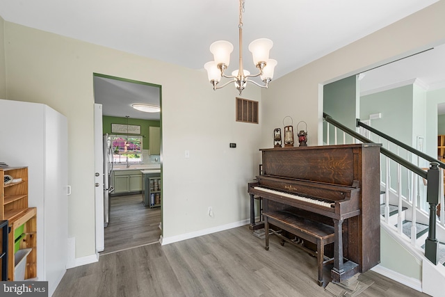 1 Deep Pond Dr, Spring City, PA 19475 - living area with wood finished floors, stairway, a chandelier, and baseboards