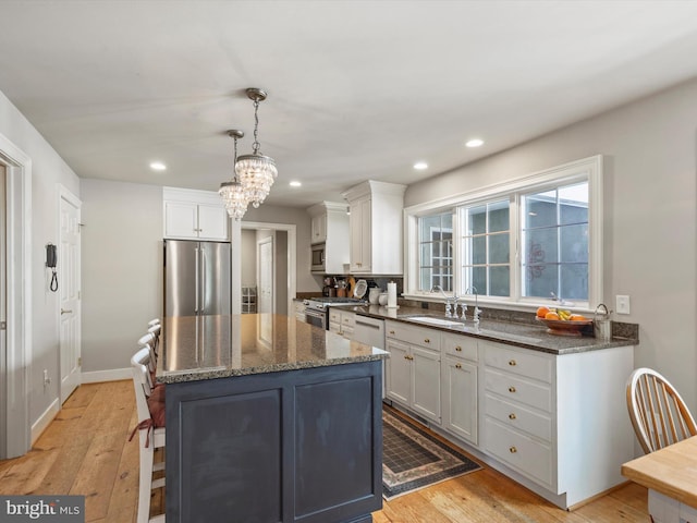 744 Goose Neck Dr, Lititz, PA 17543 - kitchen with high end appliances, a sink, light wood-type flooring, white cabinets, and recessed lighting