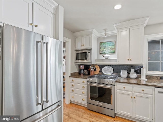 744 Goose Neck Dr, Lititz, PA 17543 - kitchen featuring appliances with stainless steel finishes, white cabinetry, dark stone counters, decorative backsplash, and recessed lighting