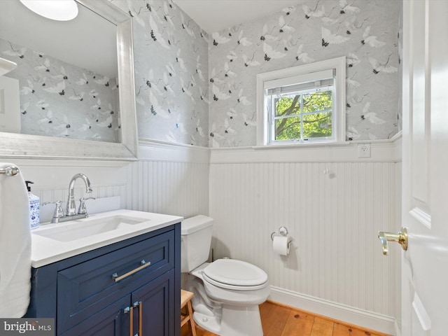 744 Goose Neck Dr, Lititz, PA 17543 - bathroom with wood finished floors, a wainscoted wall, toilet, and vanity