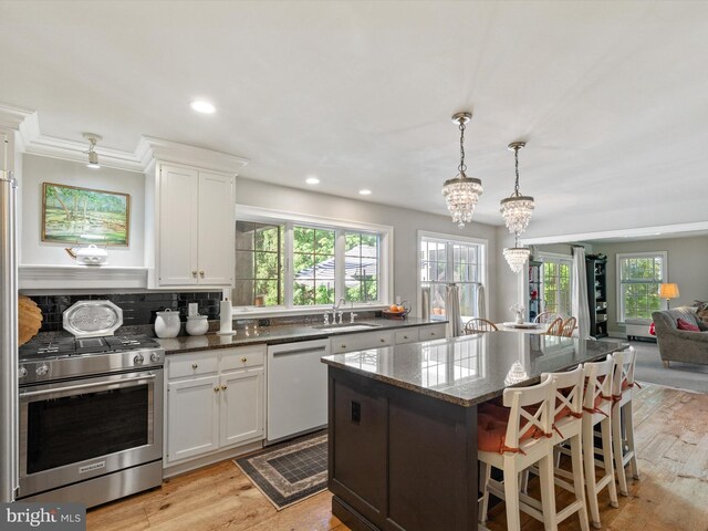 744 Goose Neck Dr, Lititz, PA 17543 - kitchen with gas range, a sink, white dishwasher, plenty of natural light, and recessed lighting